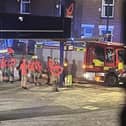Emergency service personnel at a petrol station ear to where the bomb was found