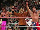 Davey Boy Smith is joined in the ring by his wife, Diana, after beating her brother Bret 'Hitman' Hart at SummerSlam '92