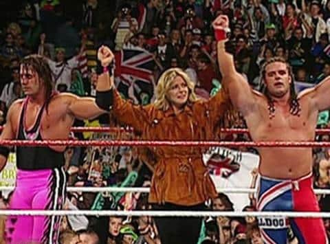 Davey Boy Smith is joined in the ring by his wife, Diana, after beating her brother Bret 'Hitman' Hart at SummerSlam '92
