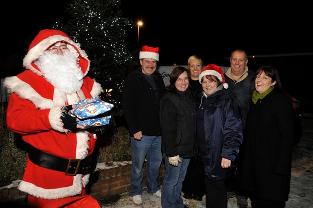 Pemberton Christmas Lights were switched on by members of Pemberton Community Association.
Trinity Girls Brass Band and Santa attended a fanily fun evening at The Swan Pub.
Pictured with Santa are LtR: Dave Arrowsmith, Alison Glover, Jayne Fitton, Helen Bennett, Steve Cartwright and Coun Jeanette Prescott