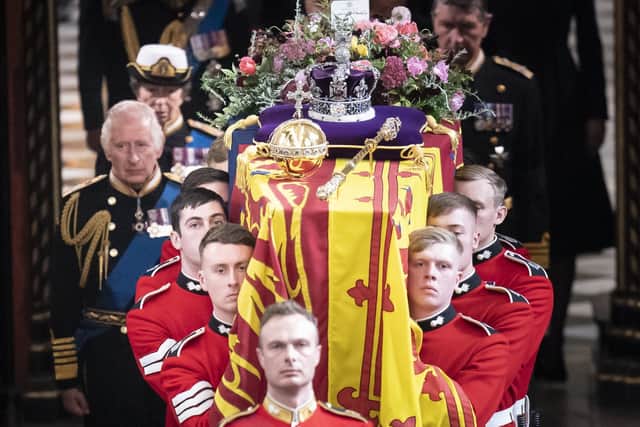 King Charles III and members of the royal family follow behind the coffin of Queen Elizabeth II, draped in the Royal Standard with the Imperial State Crown and the Sovereign's orb and sceptre, as it is carried out of Westminster Abbey after her State Funeral. Picture date: Monday September 19, 2022.See PA story FUNERAL Queen. Photo credit should read: Danny Lawson/PA Wire