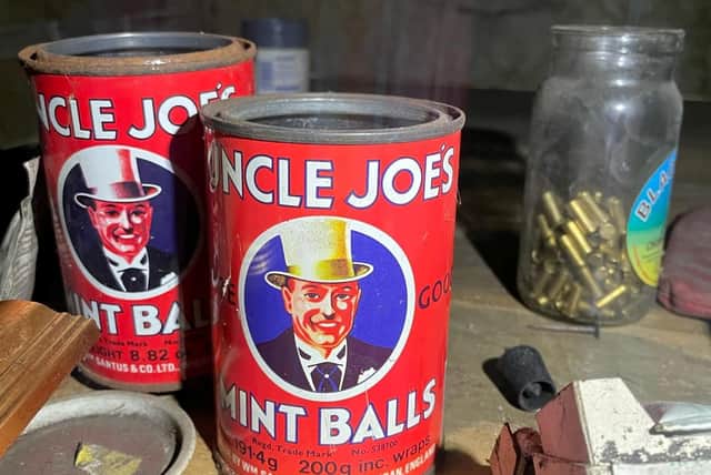 Rusting Uncle Joe's Mint Ball tins