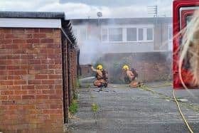 WIgan firefighters tackle the blaze on Baucher Road. Picture by Sam Hines