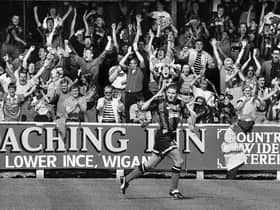 Wigan Athletic defender Paul Rennie peels away and sends the fans wild after opening the scoring in the 1-1 draw with Wycombe Wanderers in a 3rd division match at Springfield Park on Saturday 28th of August 1993.