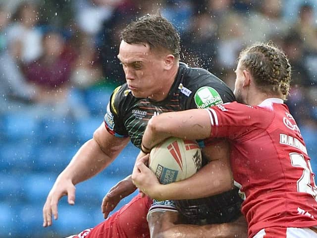 Rising Wigan Warriors prop Harvie Hill returned to first-team action against Salford Red Devils