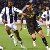 Josh Magennis hunts the ball during his lively cameo at West Brom