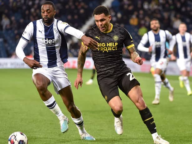Josh Magennis hunts the ball during his lively cameo at West Brom