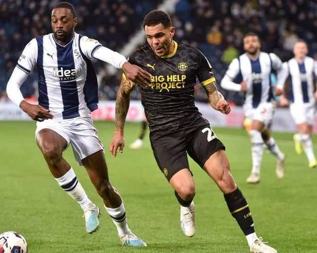 Josh Magennis hunts the ball during his lively cameo at West Brom