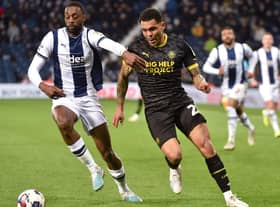 Josh Magennis hunts the ball during his lively cameo at West Brom