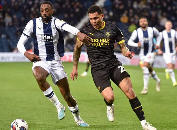 Josh Magennis hunts the ball during his lively cameo at West Brom