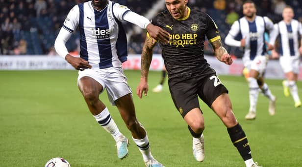 Josh Magennis hunts the ball during his lively cameo at West Brom