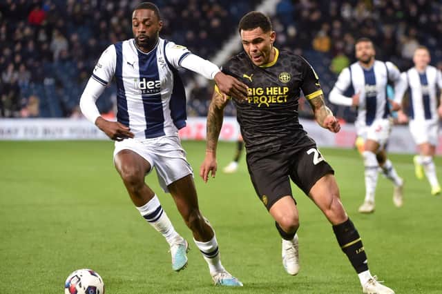 Josh Magennis hunts the ball during his lively cameo at West Brom