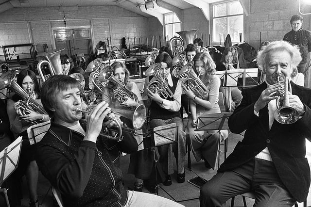 Television entertainer Roy Castle joins bandsman, Harry Mortimer, and Ashton-in-Makerfield Secondary School brass band for a recording of his BBC television show "Roy Castle Beats Time" on Friday 4th of April 1975.