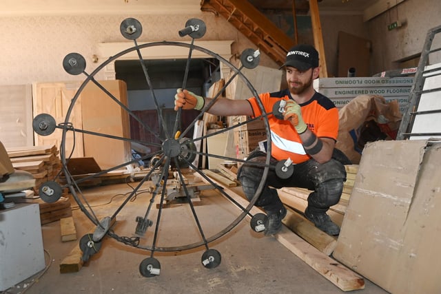 A chandelier thought to be 100-years old to be refurbished and used in the building.