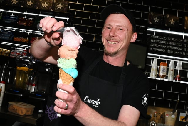 Michael Finch prepares an ice cream.