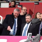 Latics chairman Talal Al Hammad (right), with chief executive Mal Brannigan (centre) and chief operating officer Dr Tom Markham (left)