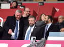Latics chairman Talal Al Hammad (right), with chief executive Mal Brannigan (centre) and chief operating officer Dr Tom Markham (left)