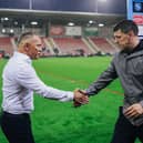 Adrian Lam (left) and Matt Peet (right) shake hands after Leigh Leopards' 18-8 win over Wigan Warriors