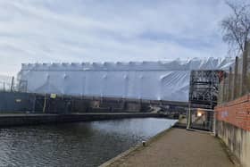 The strange scaffolding and canvas structure over the canal near Chapel Lane