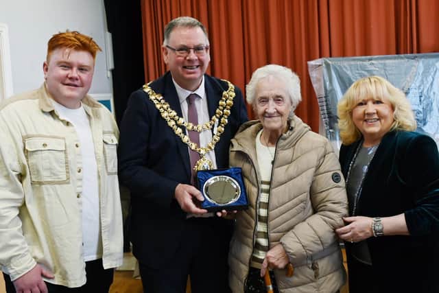 Rita Culshaw, 90, was presented with the award by the Mayor of Wigan Coun Kevin Anderson, after being nominated by Douglas councillors Matt Dawber (left) and Pat Draper (right)
