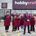 Hobby Craft store manager Andrew Toth (centre) with his team ahead of the opening of the new store