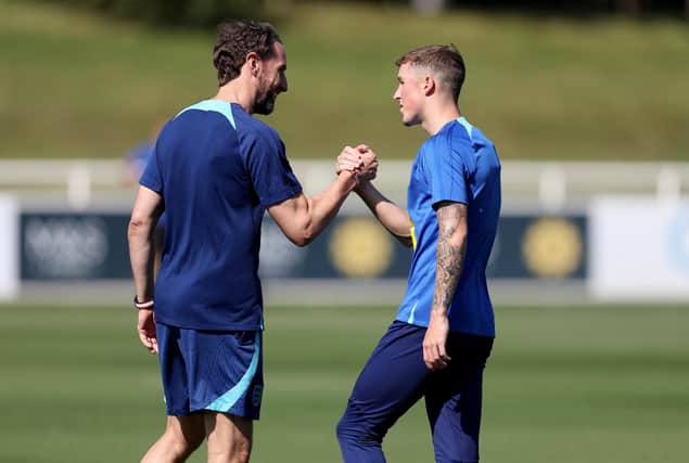 Alfie Devine with Gareth Southgate during an England senior training session earlier this season.