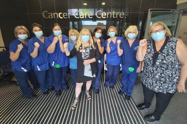 Coun Pat Draper with staff at Wigan Infirmary's cancer care centre