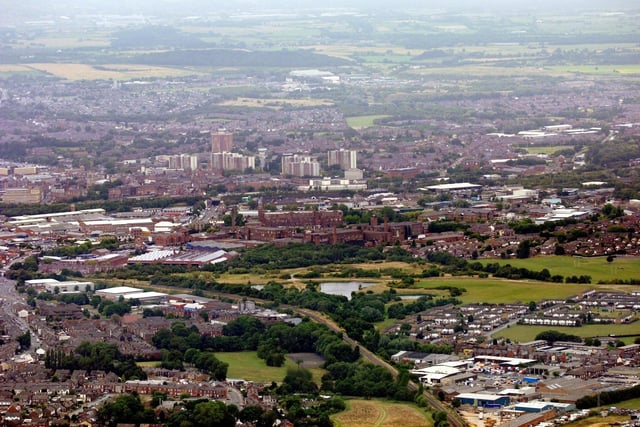 WIGAN AERIAL PICTURES - Wigan town centre viewed from above Pemberton/Highfield with Ormskirk Road leading to the Saddle Junction, left, the railway line from Wigan Wallgate to Liverpool and Warrington Road Industrial Estate and Worsley Mesnes, bottom right.