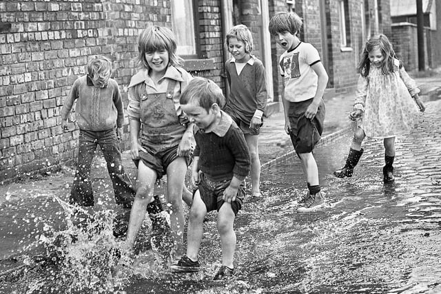 It was the long hot summer of 1976 and these Ince children made the most of the North West Water Authority testing a new water main at the junction of Ince Green Lane and Warrington Road to have some cool splashing fun on Wednesday 28th of July.
