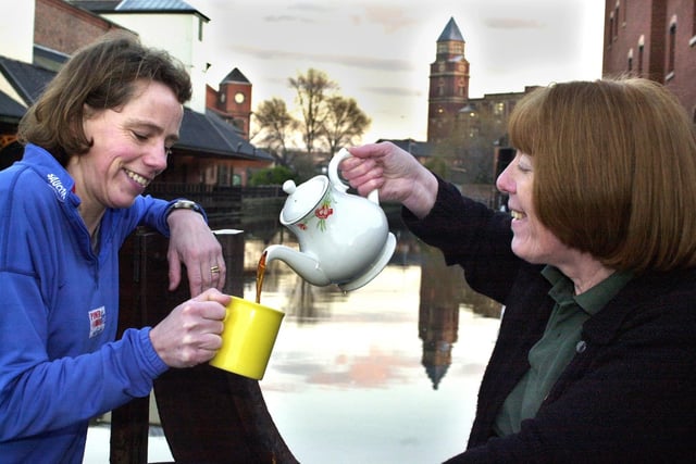 Catering assistant at Trencherfield Mill cafe, Christina Dean, serves the perfect cuppa on Wigan Pier to grateful runner Lynne Gough on Monday 6th of January 2003.
The Royal Society of Chemistry chose Wigan as the most appropriate town in which to unveil a recipe for the perfect cup of tea since in a celebrated newspaper article called 'A nice cup of tea' 4 years before his death in January 1950, George Orwell, famed for his gloomy portrayal of life in Northern England, 'The Road to Wigan Pier', attempted to define exacatly what made the flavour of tea so dear to the hearts of the nation.  But staff at Trencherfield Mill's cafe believed they already knew. A good tip is to brew it in light coloured china.