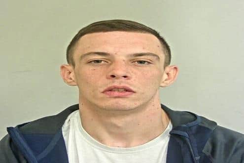 Curtis Fox is wanted for offences in both Lancashire and Merseyside