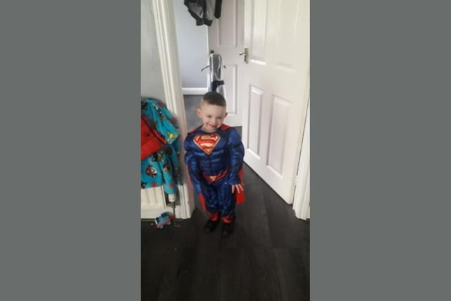 Tommy looks ready to save the day as Superman!