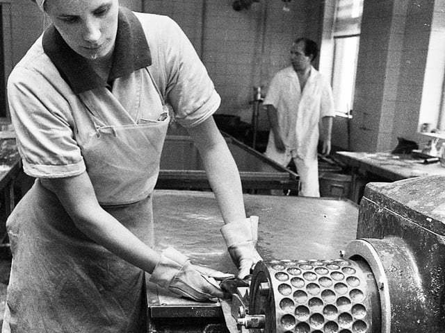 The mint balls begin to take shape feeding onto a drop roller at the Santus factory in Dorning Street, Wigan, in July 1977.