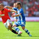 Tom Cleverley locks horns with Latics' Shaun Maloney during the 2013 Charity Shield at Wembley