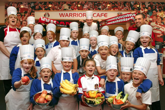2008 - Pupils from Pemberton St John's CE Primary School and Highfield St Matthew's CE Primary School in the Warriors Cafe at the Wigan Warriors CHAMPS Playing For Success Centre at Robin Park Sports Centre for the healthy eating course with chef James Holden from the Academy of Culinary Art.  Looking on are Julie Copeland, centre teacher, Janice Hart, CHAMPS assistant, and Darren Fletcher, centre manager.