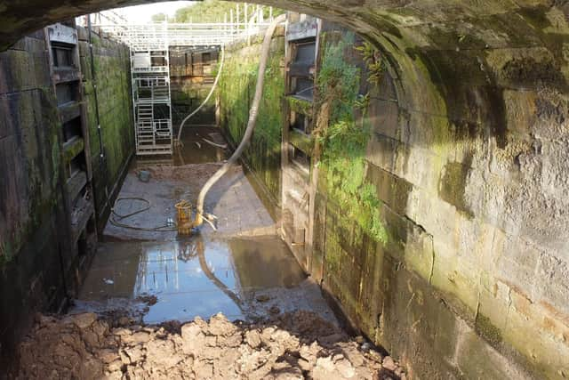 The vital repair work on one of the locks on the Wigan flight has taken longer than expected