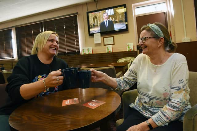 Manager Suzanne Garswood, left, enjoys a brew with Kathleen Campbell, right.