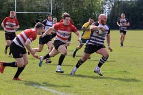 Action from Wigan's semi-final victory at Harbury of Warwickshire