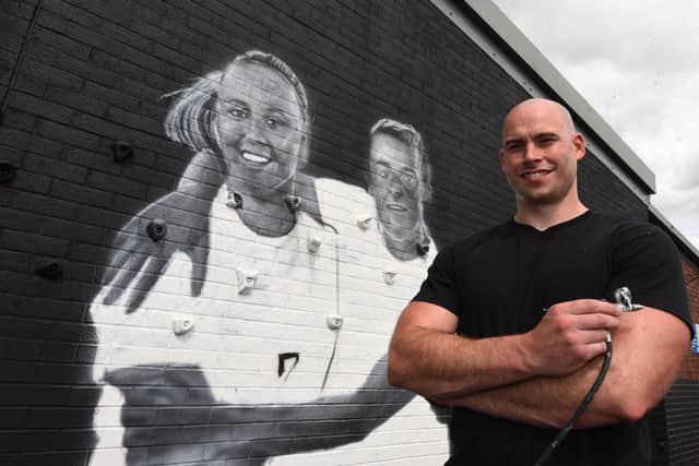Scott from Snow Graffiti, working on a mural of  inspirational people at Platt Bridge Community School, he decided to add Ladies England football team players Beth Mead and  Ella Toone,