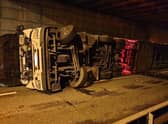 The overturned lorry causing delays