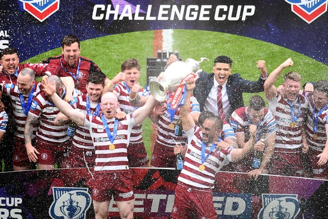 The Warriors lift the Challenge Cup.