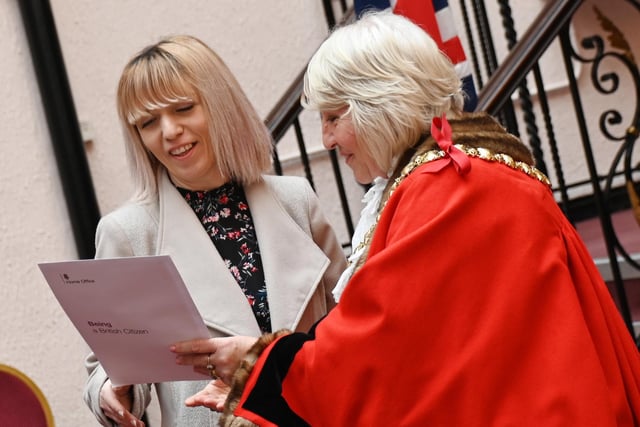The Mayor of Wigan Coun Marie Morgan  welcomes new citizens to the borough and presents certificates.