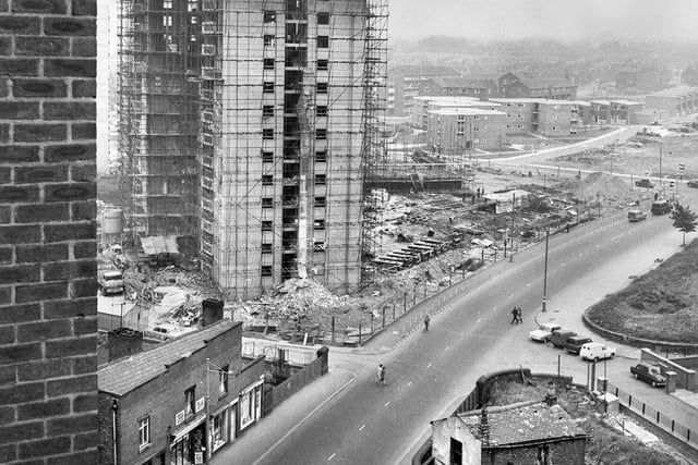1967 - The building of Scholes flats with Derby House nearing completion in 1967. A few remaining old shops can be seen still open for business near the River Douglas bridge.