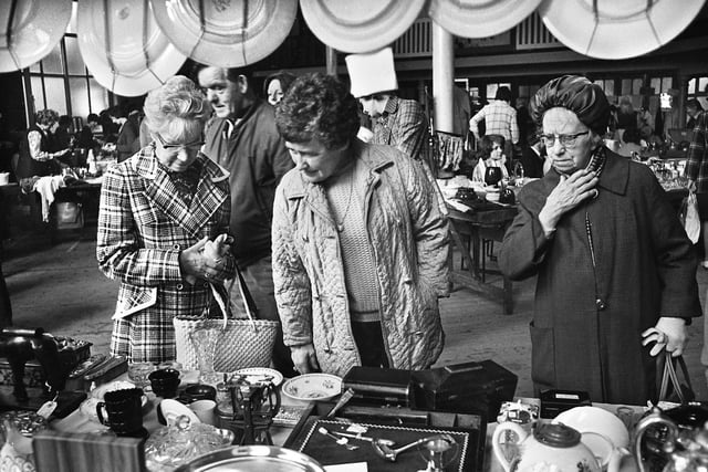 Browsing the stalls at a flea market in the Queen's Hall, Wigan, on Saturday 24th of May 1975.