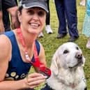 Amanda Hough with her Great North Run medal as she met a guide dog after the race