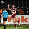 Zach Eckersley celebrates scoring a try for Wigan Warriors