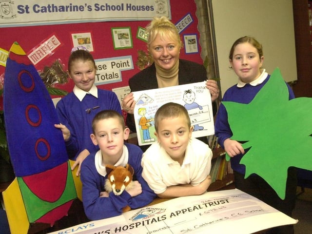 Pupils at St Catharine's primary school, Scholes, Wigan, celebrate raising funds for charity.
