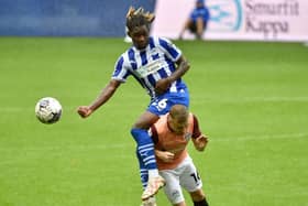 Baba Adeeko challenges for the ball against Portsmouth