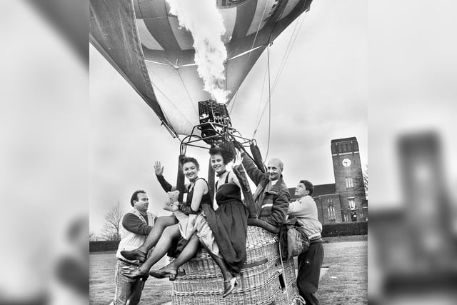CanCan girls, Amanda Bridge and Samantha Darwin, boarding a Royal Mail hot air balloon on the Mesnes playing field on Friday 20th of November 1992.
Part of the Razzamatazz dance group, they had won the opportunity in a dance competition at the Orwell pub and were taken aloft by pilot, Duncan Evans, who was also raising money for Children in Need with tethered flights.