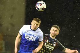 Charlie Hughes wins another header against Coventry